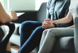 Couple holding hands in doctor's office