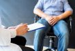 Male patient in pain at a doctor's office