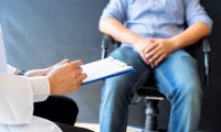 Male patient in pain at a doctor's office