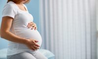 Pregnant woman sitting in a doctor's office